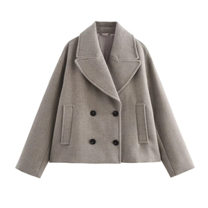 Detail view of grey double-breasted wool coat with wide lapels and black buttons