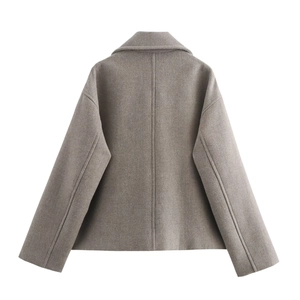 Detail view of oatmeal wool-blend jacket back featuring wide collar and refined stitching