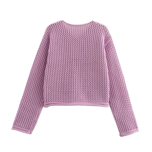 Detail of lavender knit cardigan featuring openwork crochet texture and round neckline