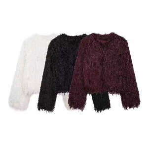 Detail view of faux fur jackets with fringe textures in white, black and burgundy
