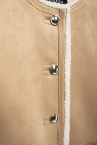 Detail view of camel suede jacket with white faux fur trim and silver metal buttons