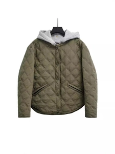 Women's army green quilted jacket with light grey hood and snap buttons in loose fit