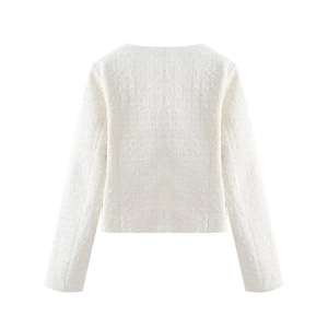 Vue arrière détaillée montrant la texture du tissu en tweed d'une veste blanche