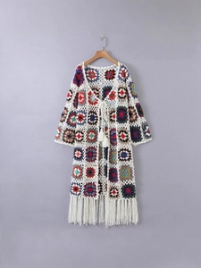 Bohemian crochet cardigan with colorful granny squares and handmade tassel details