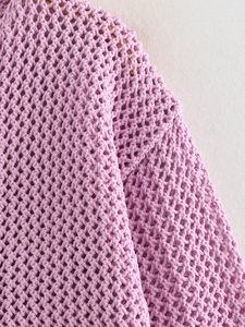 Close-up of lavender knit cardigan featuring large mesh diamond crochet texture detail