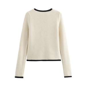 Back view of a beige knit cardigan featuring contrast black ribbed edges and soft fabric