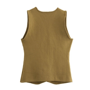 Detailed macro view of mustard yellow knit vest texture and vertical ribbed pattern finish