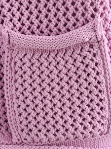 Macro detail of lavender crochet knit cardigan pocket showing high-quality yarn texture