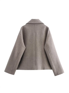 Rear view of minimalist grey short faux wool double-breasted coat with center seam detail
