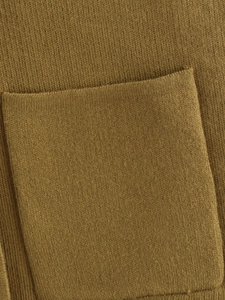 Detailed close-up of a square pocket on olive green knitted vest with fine stitching