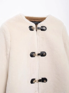 Chic cream faux fur cardigan jacket with elegant black leather buckles and gold metal hardware