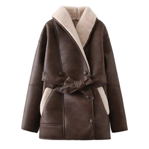 Detail of faux leather shearling coat with contrasting plush lining and waist belt