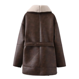 Detail view of the back of a vintage dark brown faux leather shearling coat with seam lines