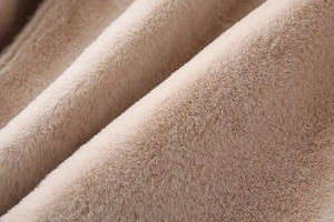 Close-up of soft faux fur lining in light beige showing plush texture and winter warmth