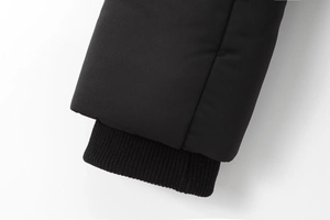 Detail of windproof ribbed inner cuff on a black winter jacket for extra warmth