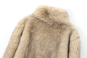 Close-up of the plush faux fur texture and collar detail on the khaki brown jacket