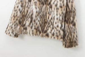 Close-up of leopard print faux fur texture and plush hem of a vintage women jacket