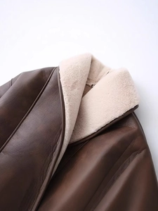 Brown leather coat with faux fur lining and contrast stitching detail for winter