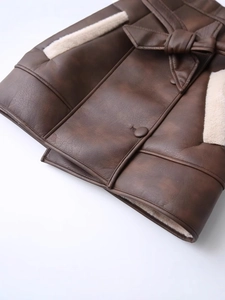 Faux leather winter coat with contrast shearling trim and decorative waist bow
