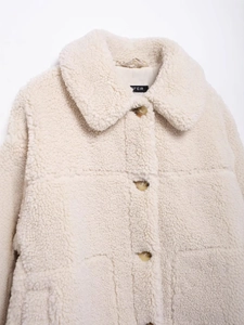 Women's cream fleece jacket featuring a lapel collar and textured button-up front
