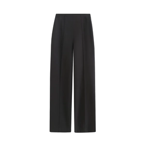 Detail of black high-waisted wide-leg trousers featuring sharp vertical pressed creases