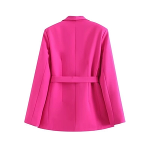 Back view of a fuchsia long-sleeved blazer with a matching belt and tailored fit