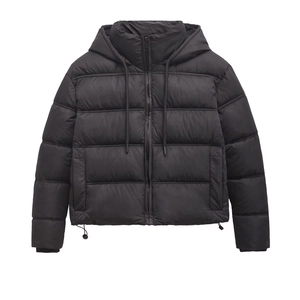 Close-up of black hooded puffer jacket with quilted padding and adjustable drawstrings