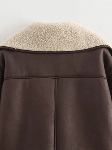 Detail of back collar with faux shearling lining on a brown faux suede jacket