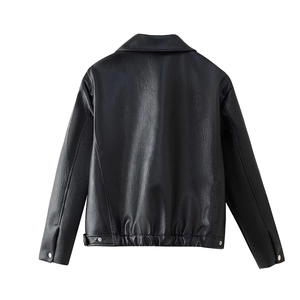 Detail view of black faux leather jacket back with elastic hem and metal buckle cuffs