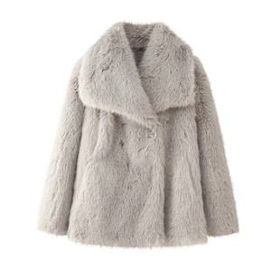Close-up of light gray faux fur coat featuring a wide lapel and thick shaggy texture
