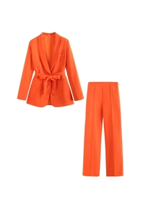 Vibrant orange two-piece women's suit with belted blazer and high-waisted trousers