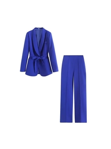 Women's royal blue two-piece formal suit featuring belted blazer and wide-leg trousers