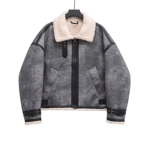 Detail of grey suede biker jacket showing cream faux shearling lining and belt buckle trim