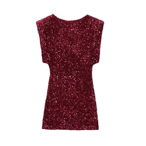Close-up detail of wine red sequin fabric texture on a sexy backless mini party dress
