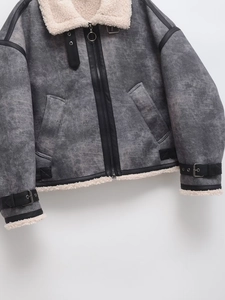 Women's oversized grey shearling biker jacket with cream faux fur lining and buckle straps