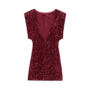 Detailed close-up of wine red sequin fabric texture on a V-neck party mini dress