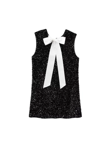 Sparkling black sequin sleeveless party mini dress featuring a large white bow back detail