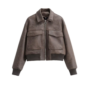 Close-up of vintage brown faux leather bomber jacket with large pockets and metal zipper