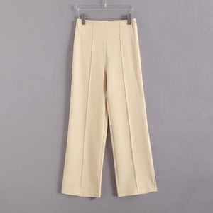 Pantalon large beige à taille haute avec plis verticaux pour tenue de bureau élégante