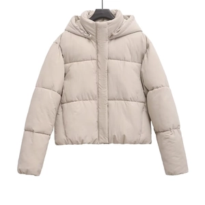Close-up of horizontal quilting and windproof collar on beige hooded puffer jacket