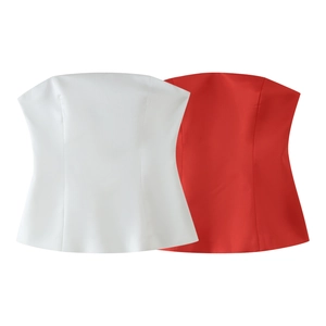 Detailed flat lay of white and red structured strapless tops with pleated design and flare hem