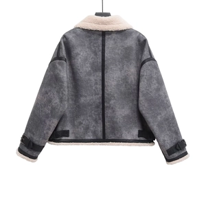 Detail view of the distressed grey jacket back featuring white faux fur and buckle straps