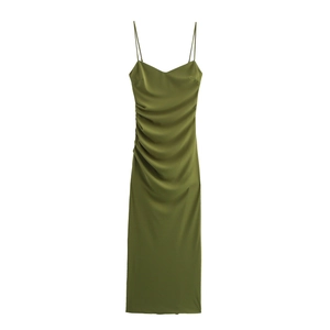 Detailed close-up of olive green satin dress featuring ruched side and silk-like fabric