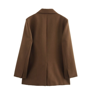 Rear view of brown minimalist blazer showing structured shoulders and center back vent detail