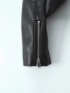 Women's black PU leather biker jacket featuring a sleek metal zipper detail on the cuff