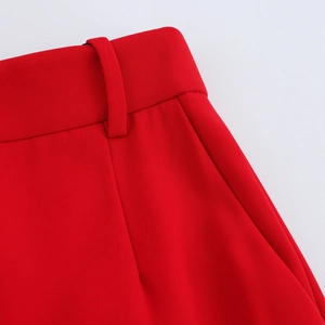 Detail of red V-neck vest pants set showing belt loops and high-quality waist pocket