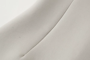 Macro shot of grey Y2K tube top showing high-quality knitted fabric texture and stitching