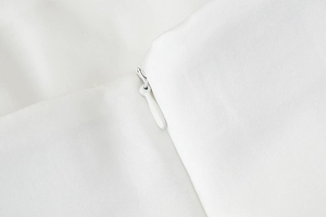 Close-up of invisible zipper detail on high-quality white Y2K strapless tube top fabric