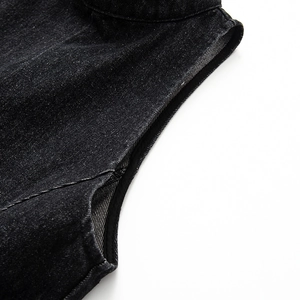 Detailed close-up showing the precise stitching and texture of black denim sleeveless dress