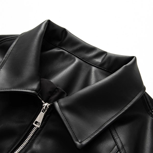 Close-up of lapel and metallic zipper on a trendy black PU leather jacket with stitching